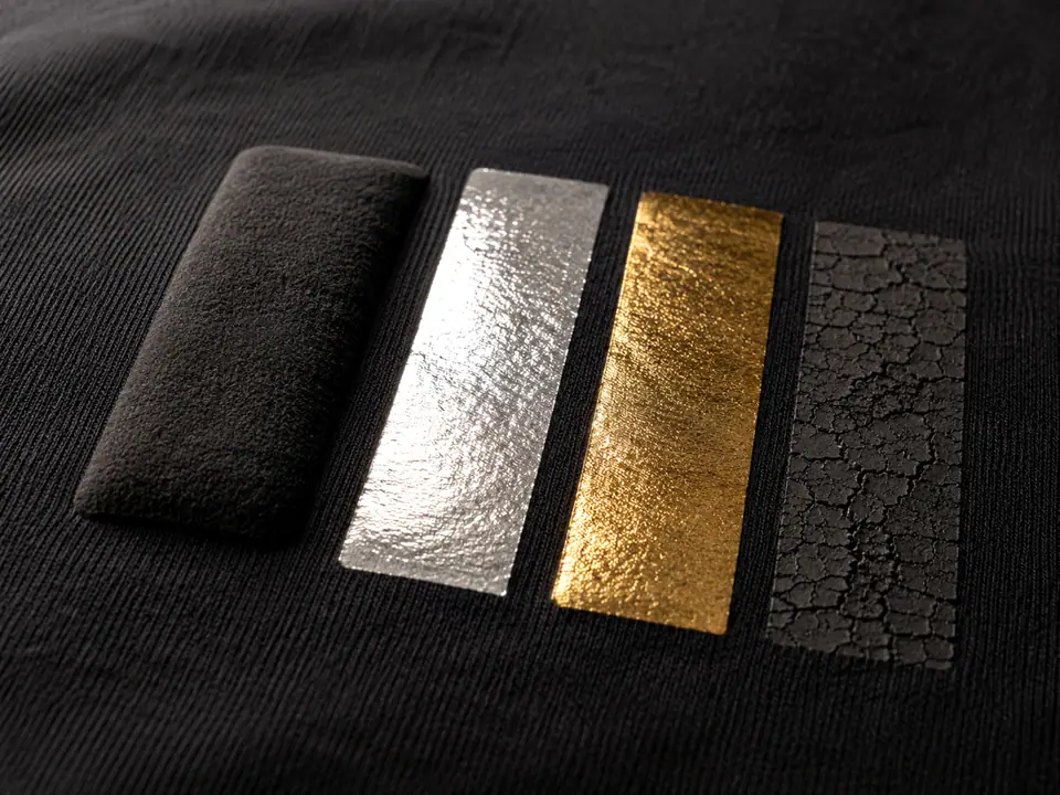 Four ink-system swatches on one panel - puff, mirror foil, metallic gold and cracked ink