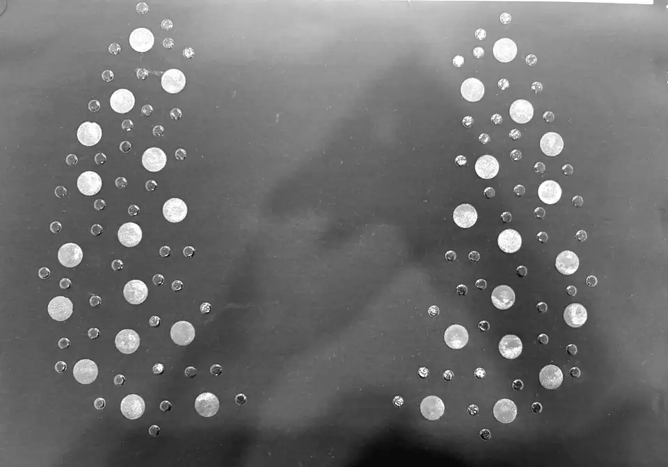 Crystal and stud placement decoration on grey fabric