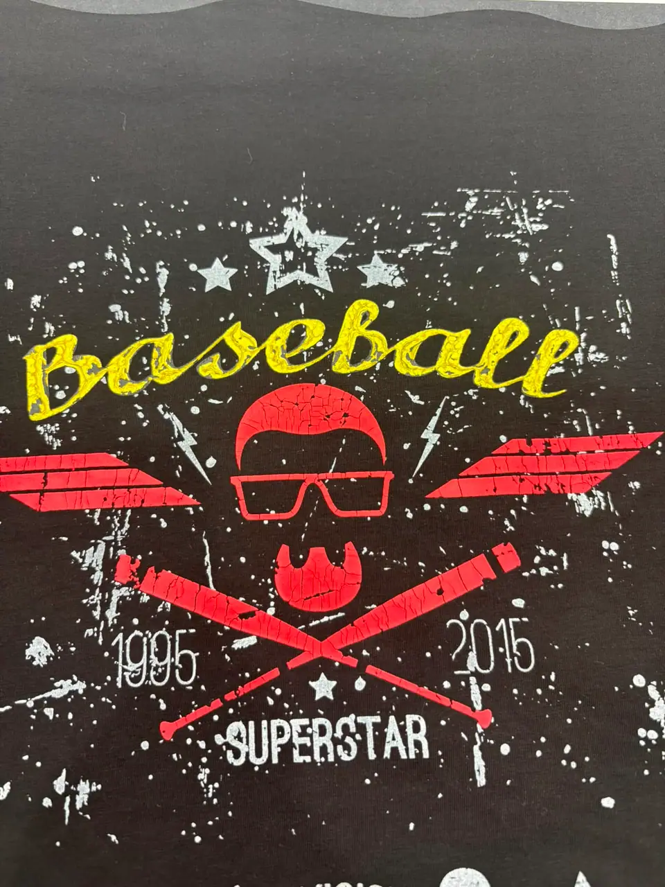 Distressed two-colour print on black fabric