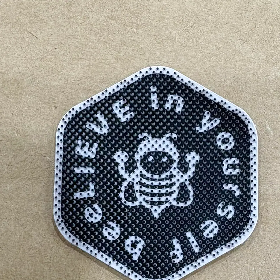 Woven patch with fine monochrome detailing